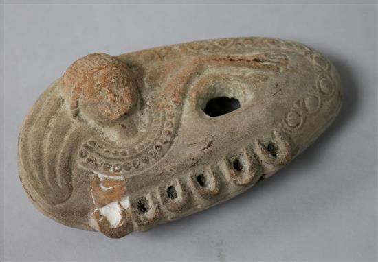 A Roman or later terracotta oil lamp, modelled as a Goddess